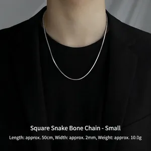 Detail of 2mm silver square snake chain necklace 50cm length on male model