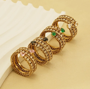 Detailed view of multi-layer 18k gold-plated rings featuring colorful heart zircons