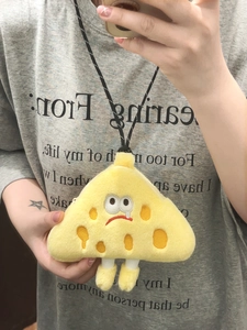 Detail of cheese-shaped plush coin purse with sad face embroidery and long neck strap