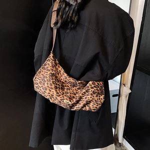 Large leopard print crossbody bag with high-quality matte finish and wide shoulder strap