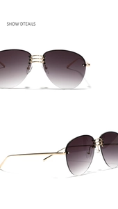 Detail of rimless pilot sunglasses with gold metal bridge and gradient grey lenses