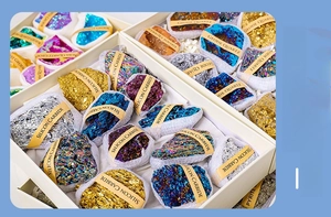 Macro shot of 12 mixed natural crystal mineral specimens including quartz and pyrite boxes
