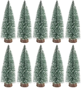 Collection of ten mini frosted cedar Christmas trees with wooden bases on white backdrop