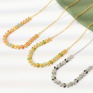 Enamel leaf link necklace in titanium steel featuring colorful geometric patterns