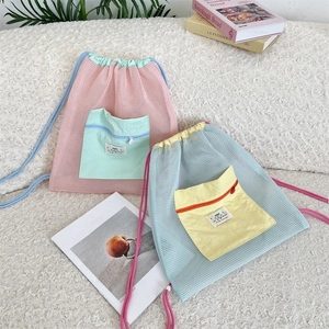Detail of mesh drawstring backpack with contrast zip pocket and breathable fabric