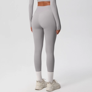 Close-up back view of high-waisted seamless yoga leggings in light grey with booty lifting cut