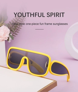 Detail of bright yellow shield sunglasses with matte frames and a youthful spirit vibe