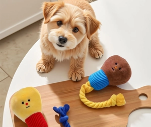 Detail of plush dog toys with durable cotton ropes and cute embroidered faces