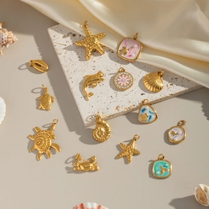 Marine life charms set in gold with colorful enamel and pearls for DIY jewelry