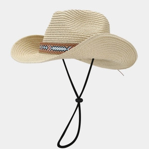 Close-up of bohemian straw sun hat featuring geometric band and adjustable chin strap