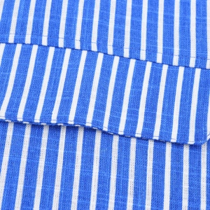 Macro detail of blue and white vertical striped linen fabric with neat stitching craft