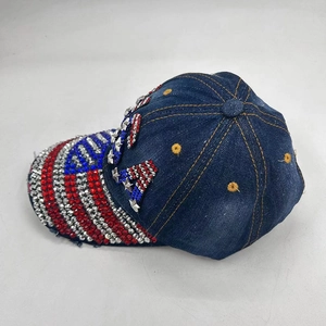 Distressed dark blue denim baseball cap with USA crystal patch and flag stripe pattern