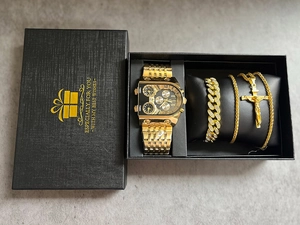 Close-up of golden Oulm men's gift set featuring a large dial watch, Cuban chain and pendant