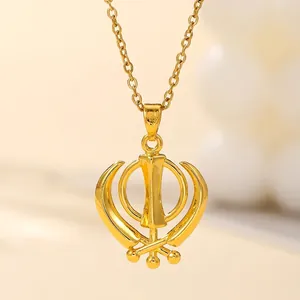 Golden Sikh Khanda pendant necklace with sparkling cubic zirconia on a dainty chain