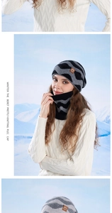 Close-up of black and grey knit beanie and neck warmer set with zigzag patterns