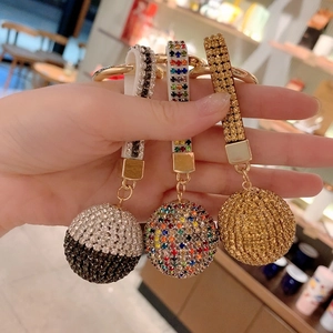 Detailed view of luxury rhinestone ball keychains in silver, colorful, and gold colors