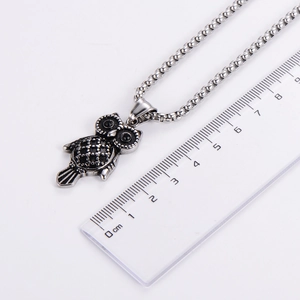 Vintage silver stainless steel owl pendant necklace with black stones and ruler for scale
