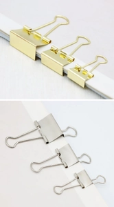 Comparison of gold and silver metal binder clips in small, medium, and large sizes