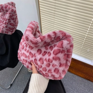 Pink leopard print plush handbag featuring a soft fuzzy texture and stylish handle grip