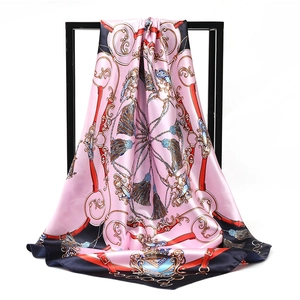 Artistic drape of pink silk scarf featuring vintage equestrian prints and blue borders