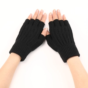 Close-up of black ribbed knit fingerless gloves showing texture and comfortable fit