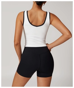Detail view of backless racerback sports bra with high-contrast monochrome paneling