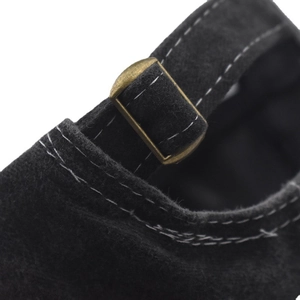 Macro shot of black washed cotton baseball cap with adjustable bronze metal buckle