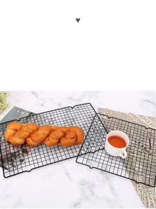 Close-up of black non-stick wire cooling rack with fine mesh for baking and grilling