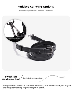 Adjustable black faux leather shoulder strap with dark metal lobster clasp and buckle