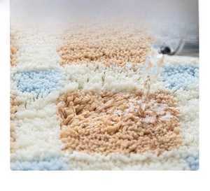 Macro shot of absorbent fine fiber bath mat showing rapid water soaking mechanism
