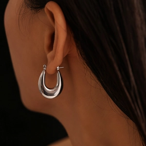 Polished silver U-shaped hoop earring for women in a minimalist stainless steel design