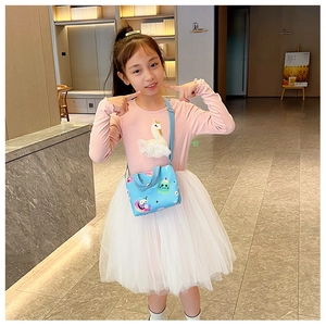 Blue kids crossbody bag with cartoon character and Sweet text shown on a young model
