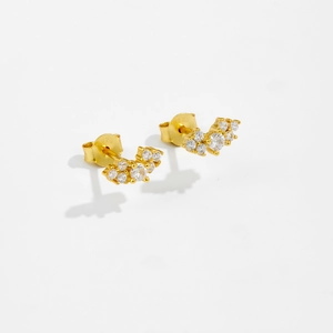 Close-up of S925 sterling silver leaf earrings with gold plating and cubic zirconia
