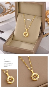 Close-up of golden dancing heart floral pendant with sparkling cubic zirconia on box