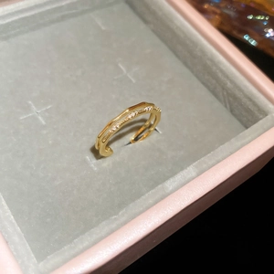 Close-up of 18k gold plated double-layer open ring with sparkling cubic zirconia inlay