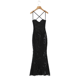 Detail of elegant black evening dress showing 3D floral lace and lace-up back design