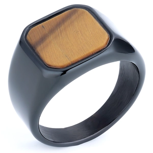 Detailed close-up of a men's black stainless steel signet ring with tiger eye stone inlay