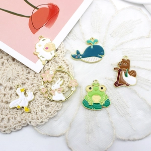 Detailed close-up of cute DIY animal alloy charms with colorful drip oil finish