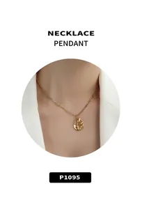 Close-up of 18k gold vintage oval hollow pendant with delicate floral relief on a fine chain