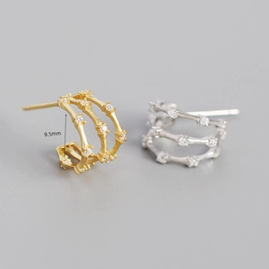 Detail view of 9.5mm triple-layer bamboo earrings with sparkling cubic zirconia inlay