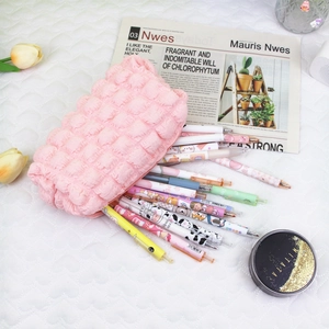 Detailed view of large pink bubble fabric pencil case showing spacious interior storage