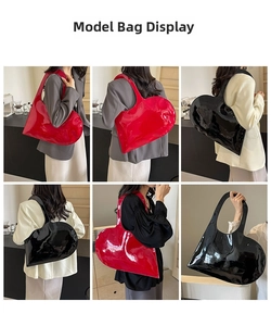 Detail of red and black heart-shaped tote bags in glossy patent leather finish