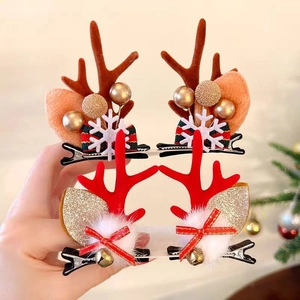 Festive 4-piece Christmas antler hair clips with reindeer ears and bells for women
