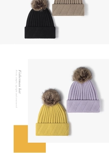Detail showing knit texture and faux fur pom-pom on diverse winter beanies