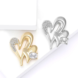 Minimalist alloy heart brooches in gold and silver with sparkling crystal inlay details