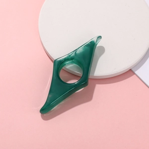 Creative thumb book holder in dark green marble resin for comfortable reading support