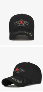 Detail of red star embroidery and U.S. ARMY gold text on a black cotton baseball cap