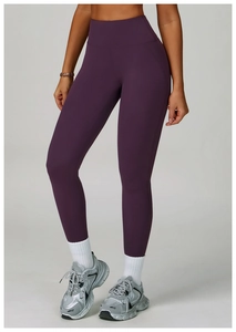 Close-up of high-waisted dark purple yoga leggings featuring tummy control and lifting effect