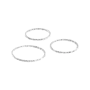 Set of three minimalist S925 sterling silver rings with faceted texture on white background