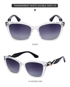 Detail view of transparent white cat eye sunglasses with gray gradient lenses and V-shape trim